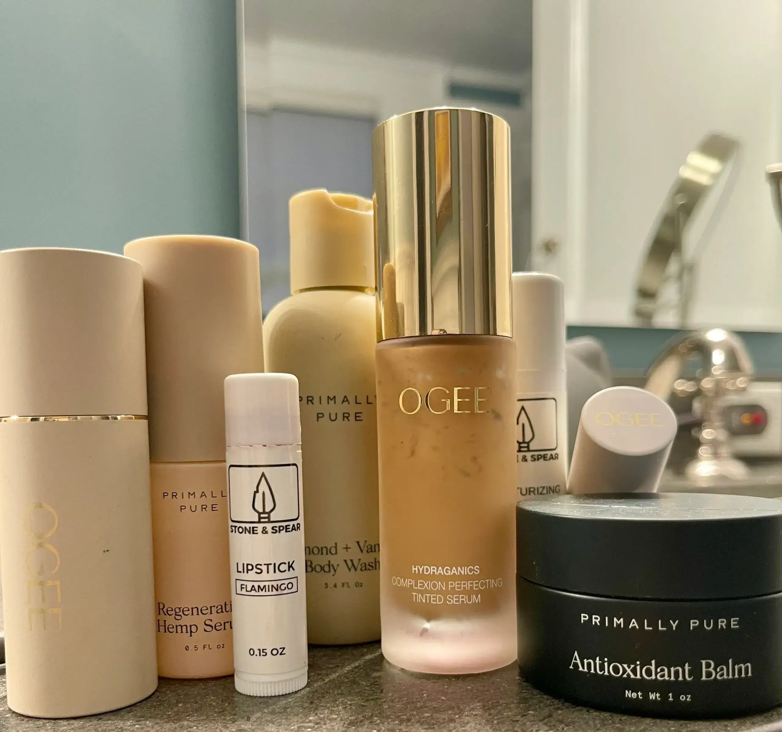 Skincare products and lip balm on counter.